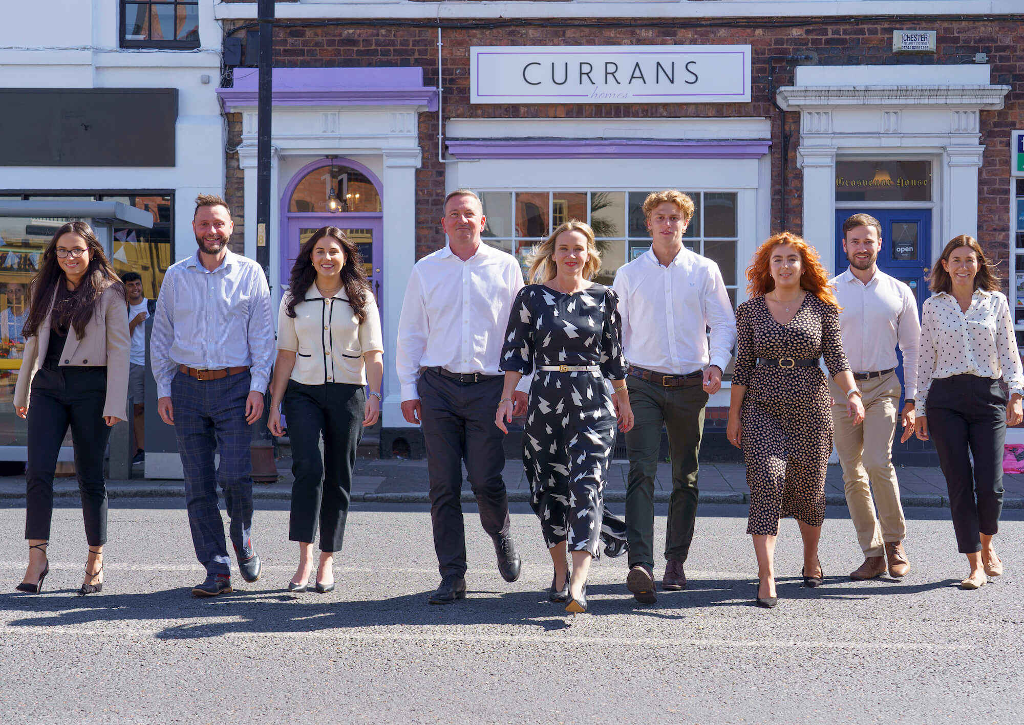 Employees of Chester-based independant lettings agency Currans Homes post outside their Chester office.
