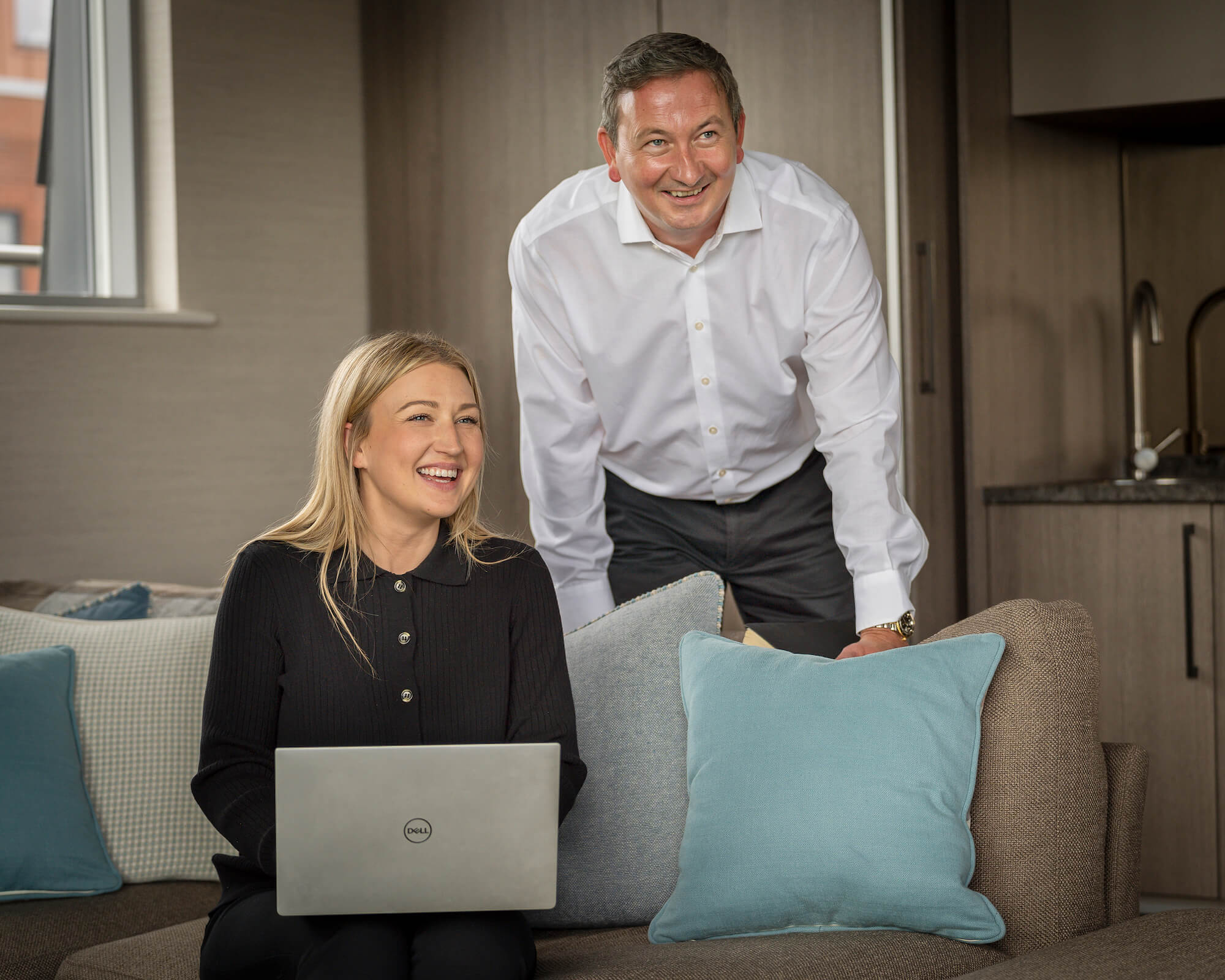 Chester property experts at Currans Estate Agents smile at an out of shot member of staff as they ensure all of their industry endorsements and memberships are up to date and in compliance.